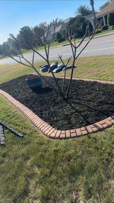 New weed barrier fabric laid in a bed before the rock goes back