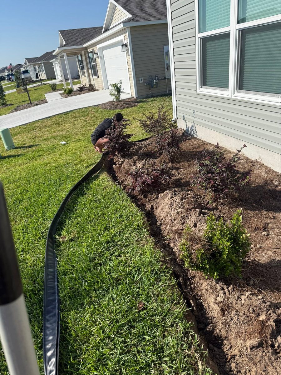 Bed edging & fabric install — Neuman's Property Services, Central Florida